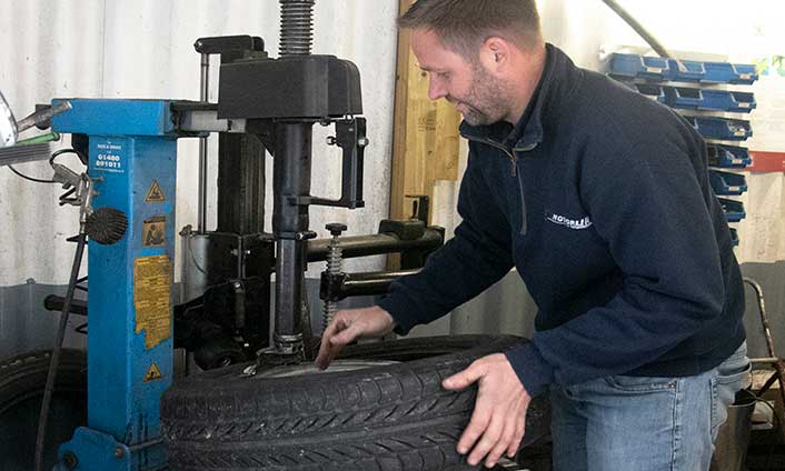 owner, Mark, fitting a tyre in the tyre bay
